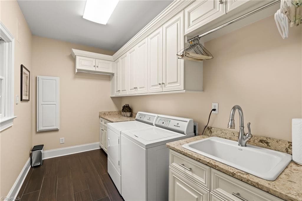 Main level laundry room with wash sink and storage - 11555 Double Spring Road, Lewisville NC 27023, Lewisville