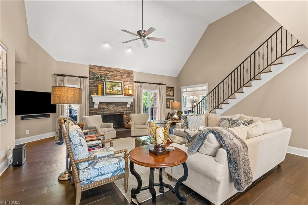 Vaulted ceilings, stone fireplace with gas logs, and custom staircase built in 2014 - 11555 Double Spring Road, Lewisville NC 27023, Lewisville