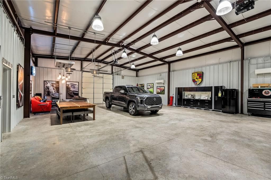 Heated and cooled by dual mini splits, LED lighting, Sonos sound system, alarm, bathroom, garage bays, and separate septic system - 11555 Double Spring Road, Lewisville NC 27023, Lewisville