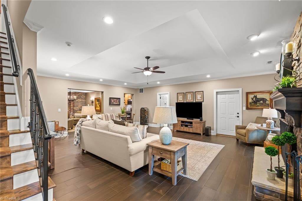 Luxurious lower level with stone fireplace, gas logs, extensive storage, kitchen, wine cellar, and garage bay. - 11555 Double Spring Road, Lewisville NC 27023, Lewisville