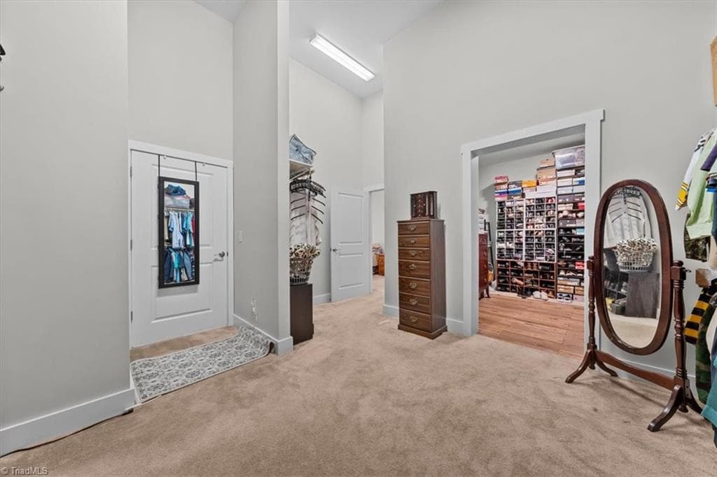 Oversized walk-in closet with extensive storage and organization space - 2207 Sierra Trace Road, Denton NC 27239, Denton