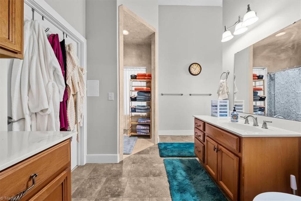 Well-appointed primary bath with dual vanity, tiled shower, Tub and generous storage - 2207 Sierra Trace Road, Denton NC 27239, Denton