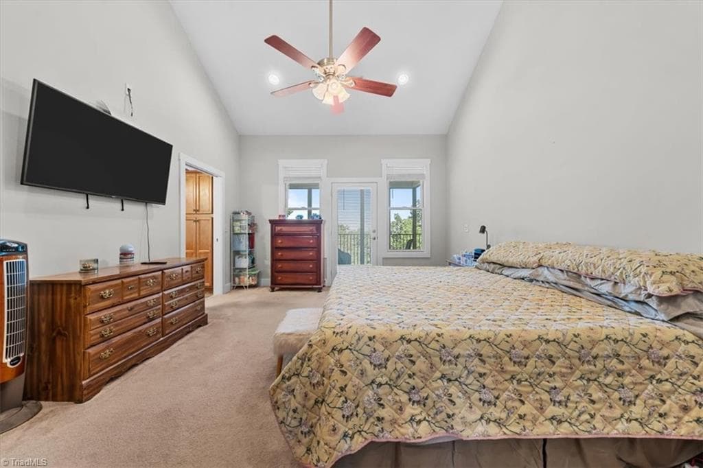 Spacious primary suite featuring vaulted ceilings and private outdoor access - 2207 Sierra Trace Road, Denton NC 27239, Denton