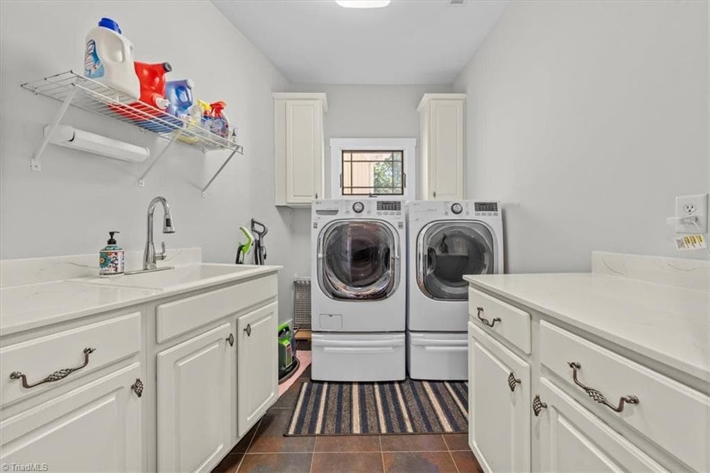 Large laundry room with ample cabinetry, workspace, and utility sink - 2207 Sierra Trace Road, Denton NC 27239, Denton