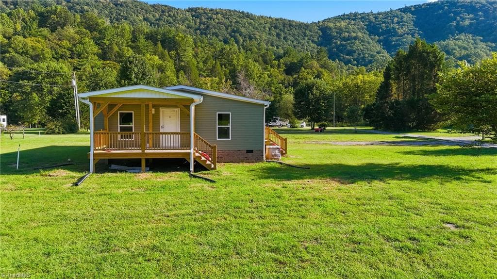 Manufactured Home at 7825 NC Highway 16, Millers Creek NC 28651, photo 2 of 41