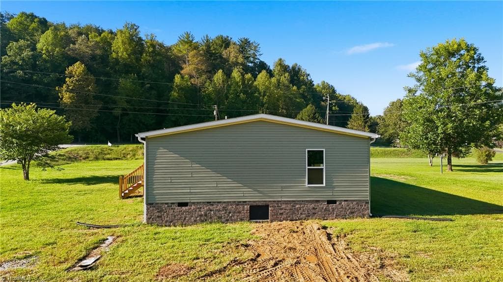 Manufactured Home at 7825 NC Highway 16, Millers Creek NC 28651, photo 6 of 41