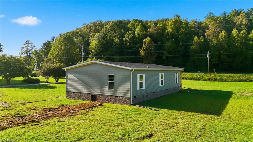 Manufactured Home at 7825 NC Highway 16, Millers Creek NC 28651, photo 7 of 41