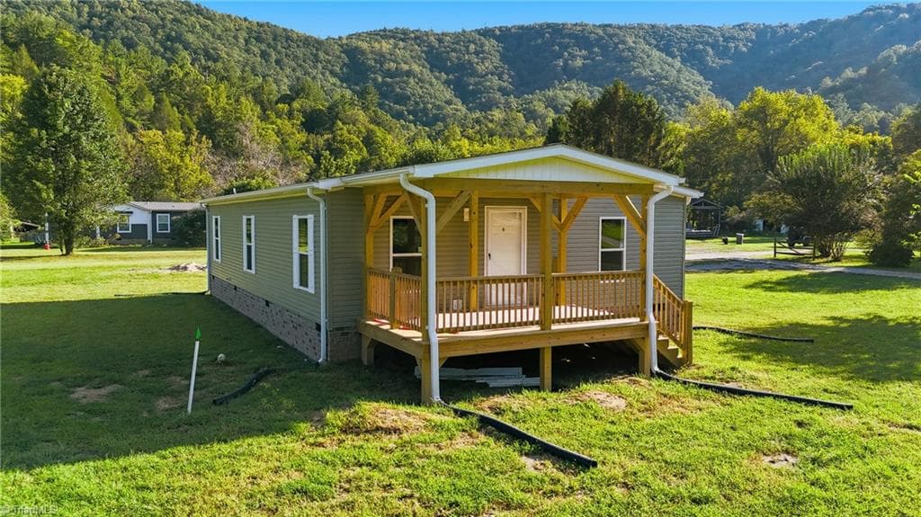 Manufactured Home at 7825 NC Highway 16, Millers Creek NC 28651, photo 3 of 41