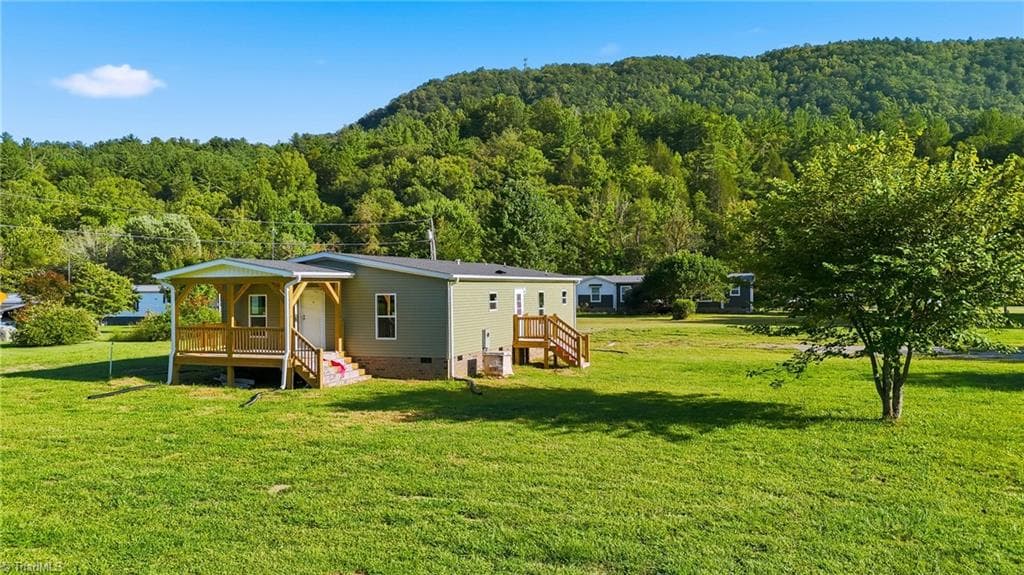 Manufactured Home at 7825 NC Highway 16, Millers Creek NC 28651, photo 4 of 41