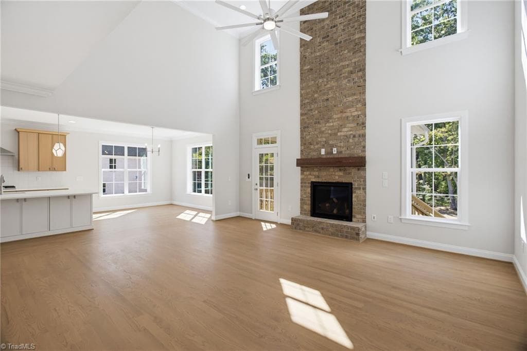 Gas log fireplace with brick accent to ceiling - 4035 Estate Drive, Lewisville NC 27023, Lewisville