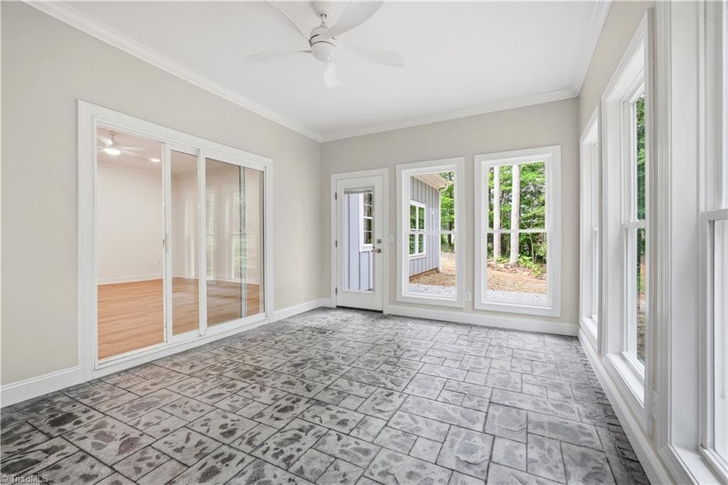 Sunroom flows into Living Room and has an extended back Paved Patio. - 2646 Johns Ridge Drive, Asheboro NC 27205, Asheboro