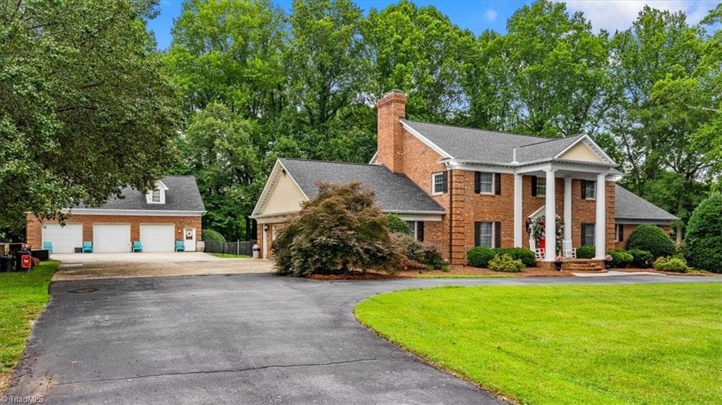 The circle drive welcomes you to the 5 car garage spaces. - 6352 Turnpike Road, High Point NC 27263, High Point