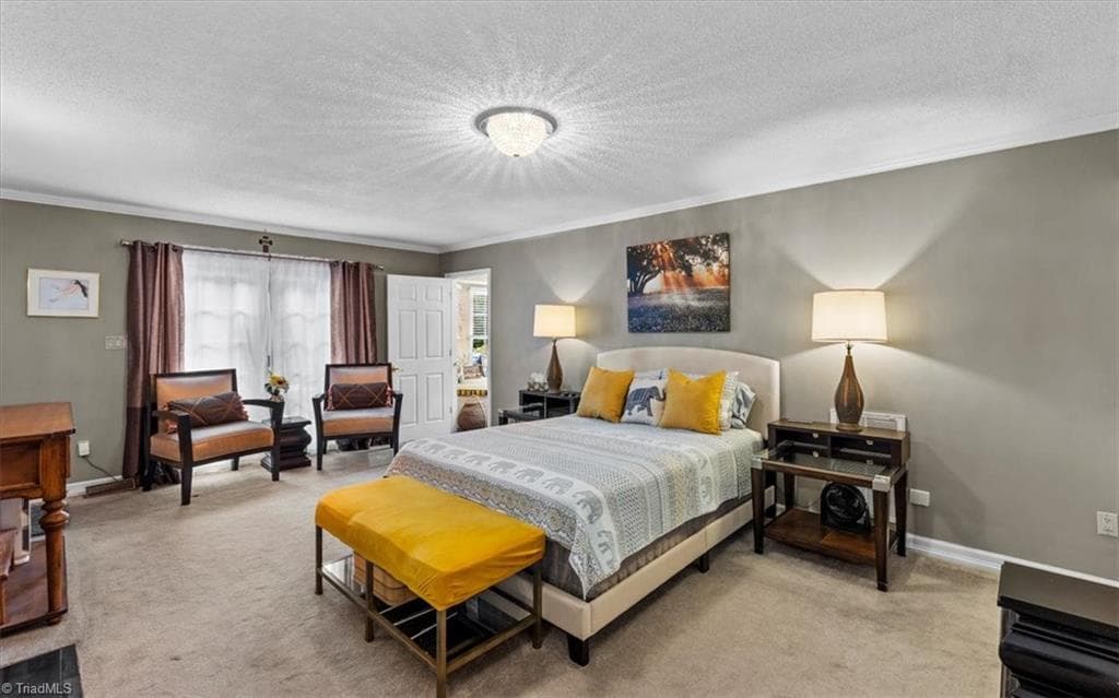 Off of the foyer and kitchen is another flex space for formal living or another spot for whatever you choose. This room also features the fireplace and access to the kitchen and mud/laundry room. - 6352 Turnpike Road, High Point NC 27263, High Point