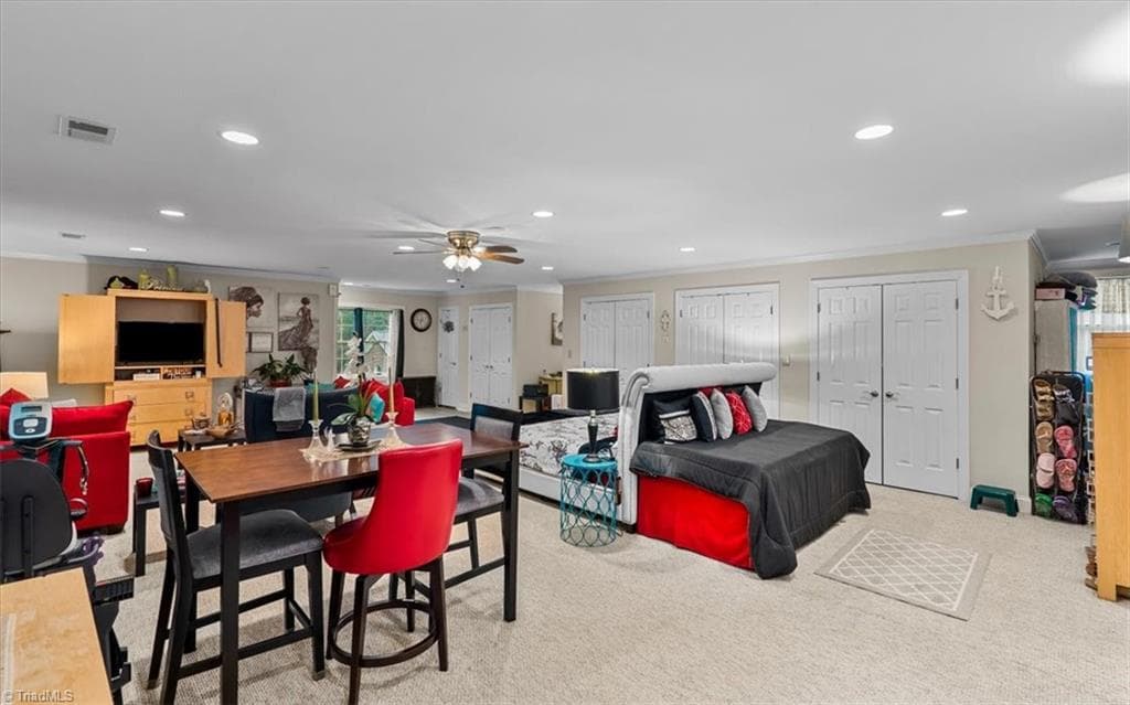 Currently, a king bed set, living room set, dining table, and kitchenette set up provides versatility for the owner. - 6352 Turnpike Road, High Point NC 27263, High Point