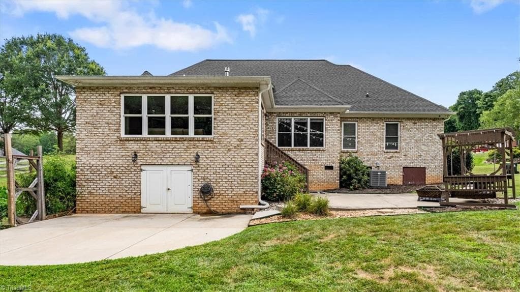 Back of home with large storage space under sunroom - 592 Carson Ridge Drive, Oak Ridge NC 27310, Oak Ridge