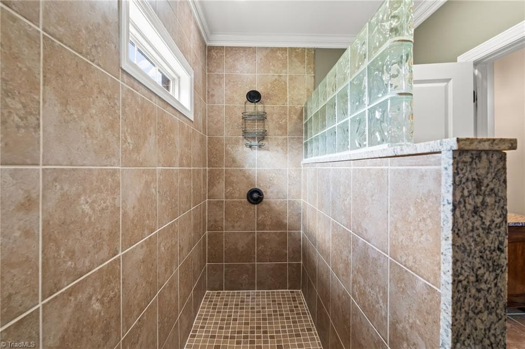 Tile shower in main level bathroom - 6202 Herons Nest Court, Oak Ridge NC 27310, Oak Ridge
