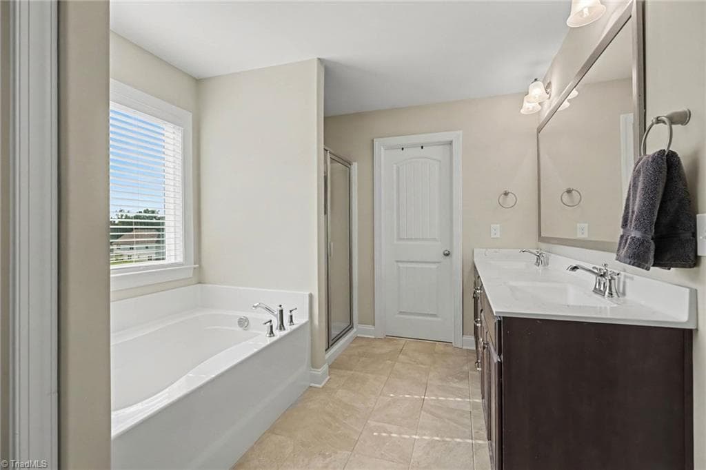 Primary bathroom with double vanity, separate shower and tub - 210 Marguerite Court, Reidsville NC 27320, Reidsville