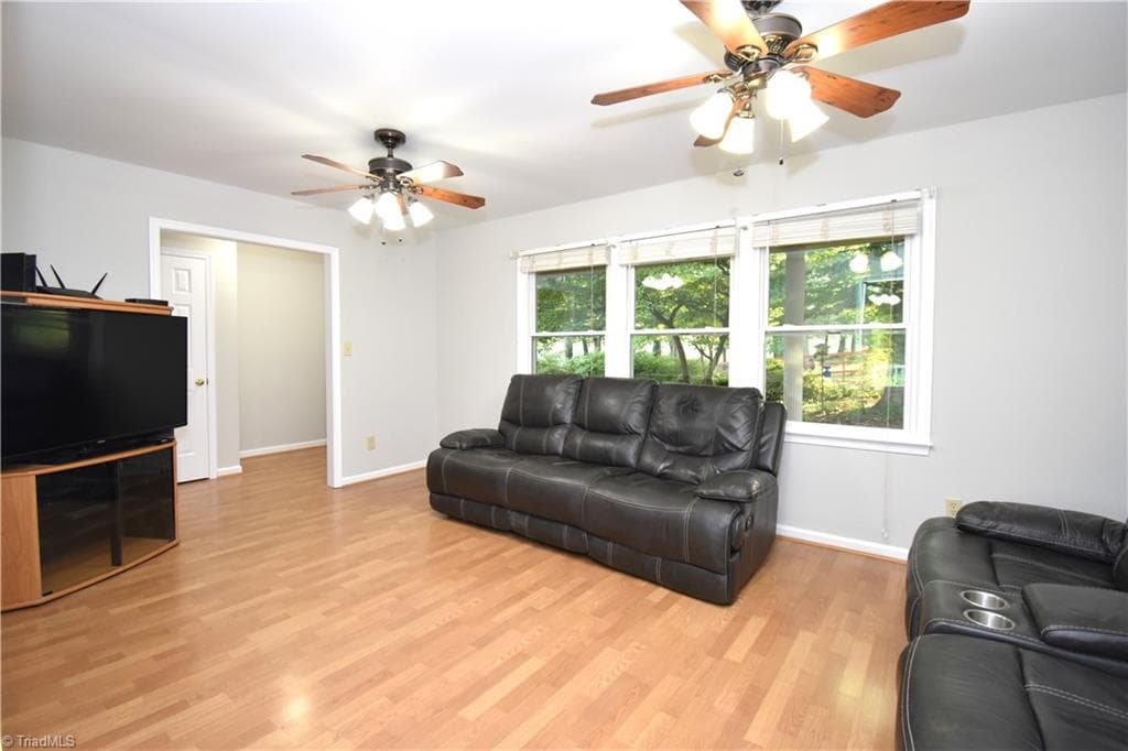 The main living room is just off the front door. - 8546 Hudson-James Road, Summerfield NC 27358, Summerfield