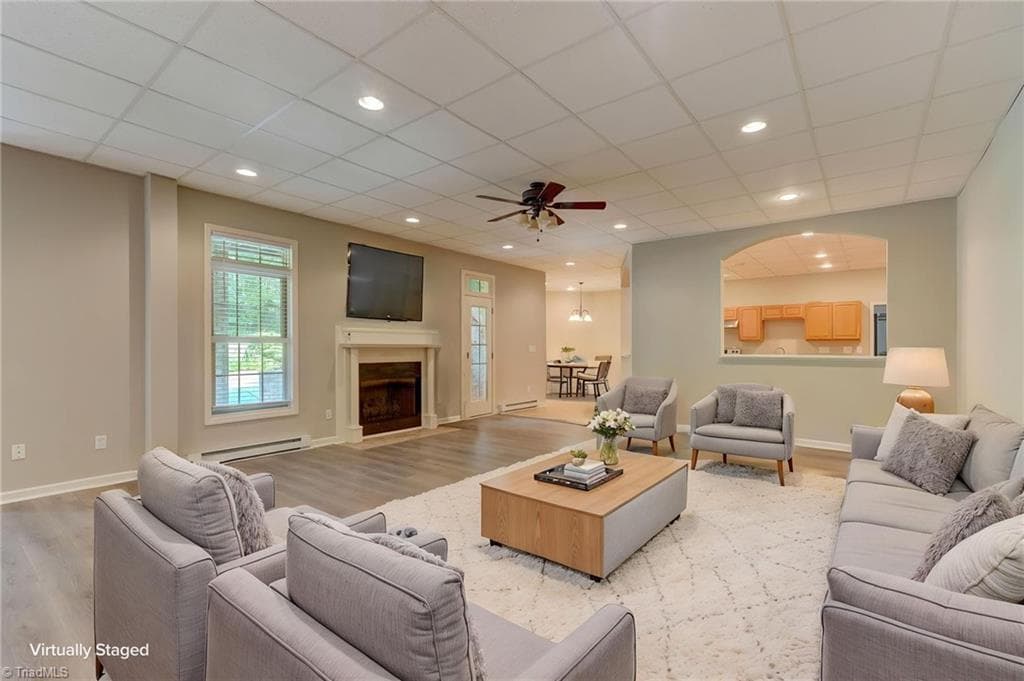 Finished walkout basement offers exceptional versatility, ideal for a guest suite/5th bedroom or extended living space. - 4404 Liguria Court, Summerfield NC 27358, Summerfield