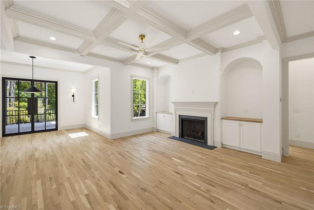 Living area with coffered ceiling, gas fireplace and soapstone surround. - 568 N Bunker Hill Road, Oak Ridge NC 27310, Oak Ridge