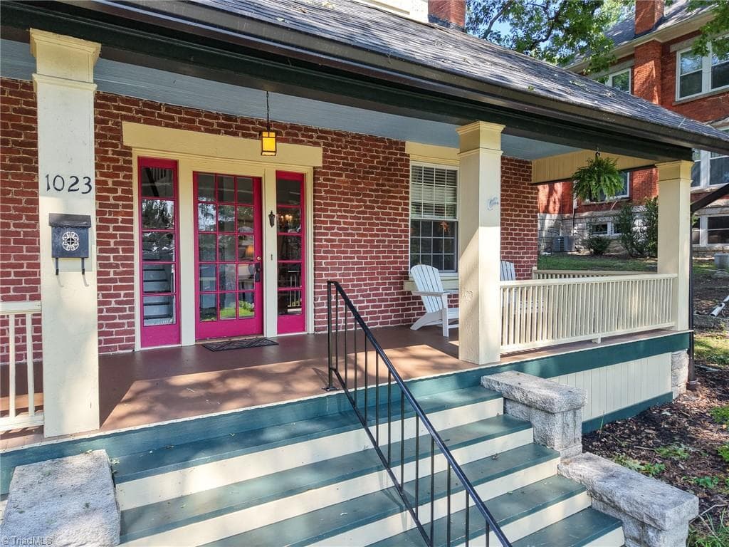 Now that's a front porch!  Measuring 38 feet long, and 8 feet wide, you can fit any number of rocking chairs out here! - 1023 N Main Street, Mount Airy NC 27030, Mount Airy