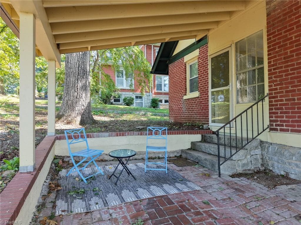 The carport can also function as an outdoor living space - 1023 N Main Street, Mount Airy NC 27030, Mount Airy