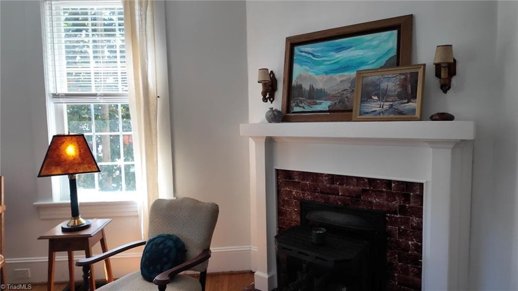 Another original fireplace with gas logs is located in the Den - 1023 N Main Street, Mount Airy NC 27030, Mount Airy