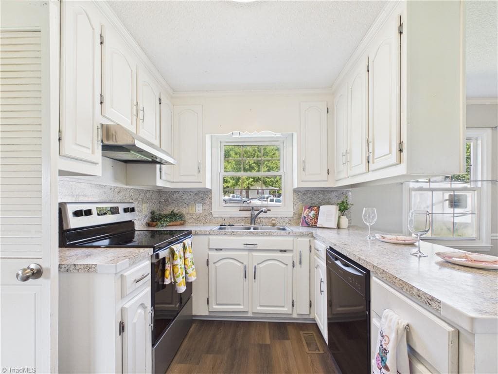 Lots of cabinet space and countertop to get meals ready for your family. - 5476 Jesse Small Road, Randleman NC 27317, Randleman