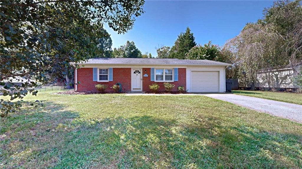 Front of home shows a nice size yard and that the home is off the street, nice long driveway for guest - 1804 Ramsey Road, Kernersville NC 27284, Kernersville