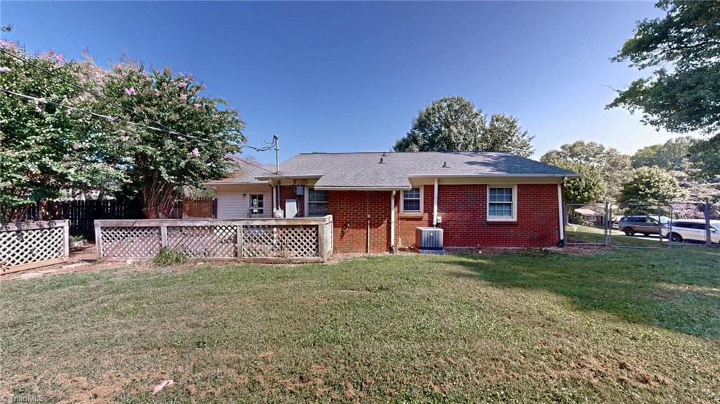 Back of the home you see the enclosed patio area - 1804 Ramsey Road, Kernersville NC 27284, Kernersville