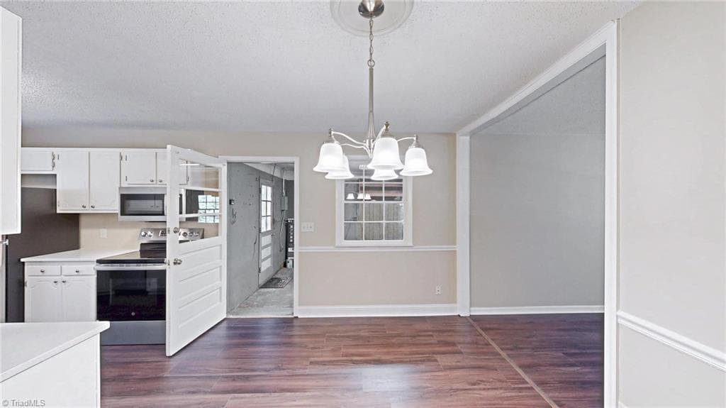 Dining area and door leading to the Garage for easy access to bring in the groceries - 1804 Ramsey Road, Kernersville NC 27284, Kernersville