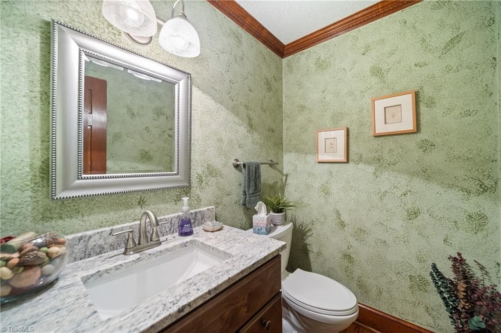 Main level powder room. - 204 Tullyries Lane, Lewisville NC 27023, Lewisville