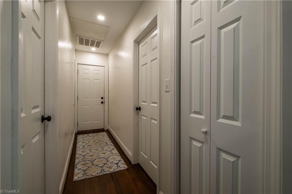 Hallway leading to garage, bedroom and second full bath. Photo taken 2025. - 629 Oakland Drive, Elkin NC 28621, Elkin