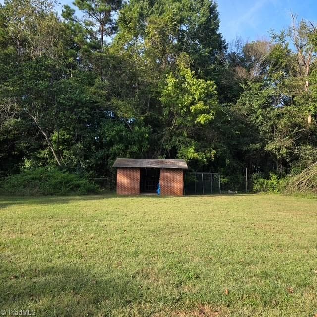 Backyard with a small brick storage building - 2091 Junction Road, Mocksville NC 27028, Mocksville
