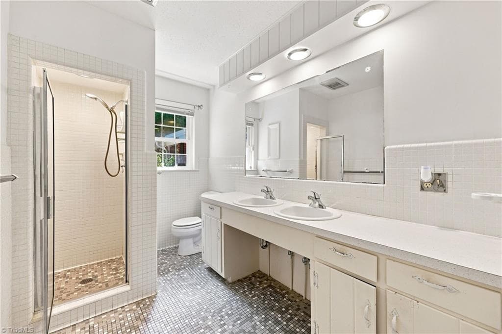 primary bathoom with door to primary bedroom - 2036 E Pine Street, Mount Airy NC 27030, Mount Airy