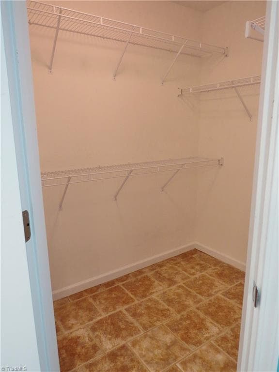 Her walk in closet - 132 Feather Ridge Circle, Reidsville NC 27320, Reidsville