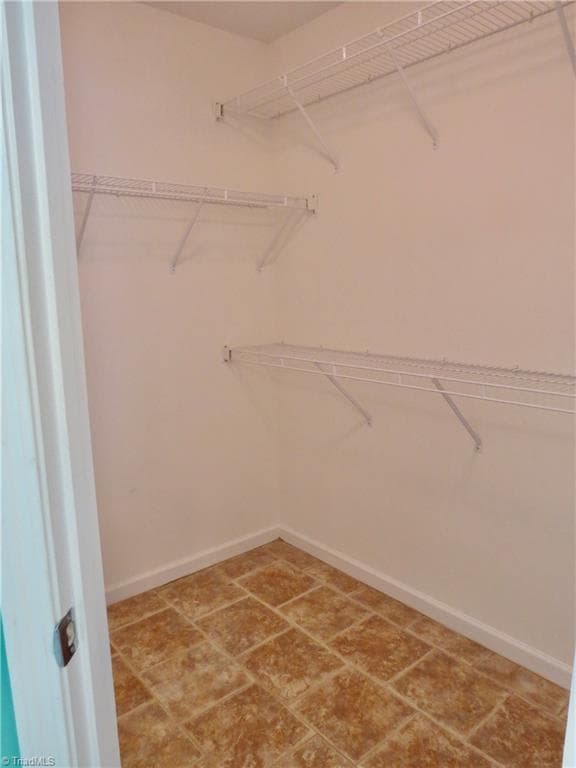 His walk in closet - 132 Feather Ridge Circle, Reidsville NC 27320, Reidsville
