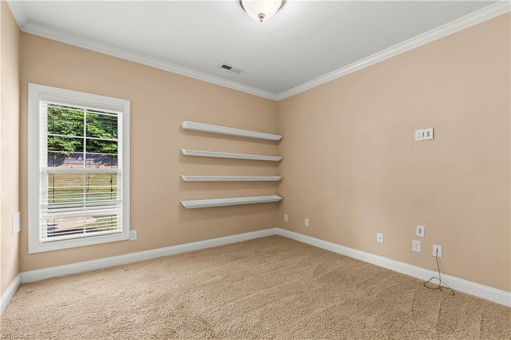 Main-level bedroom (4) with shelving - 1249 Meadow Chase Drive, Lewisville NC 27023, Lewisville