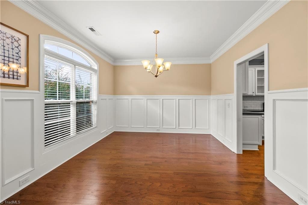 Welcoming dining room with wainscoting - 1249 Meadow Chase Drive, Lewisville NC 27023, Lewisville