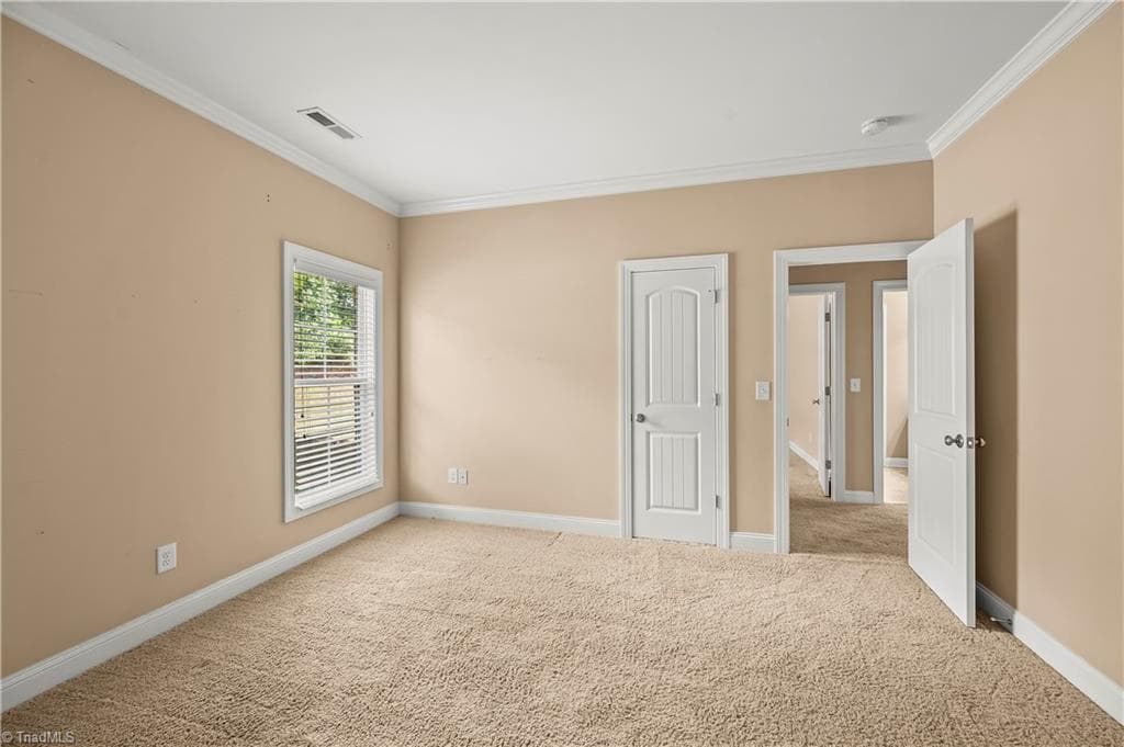 Generous bedroom 2, crown molding - 1249 Meadow Chase Drive, Lewisville NC 27023, Lewisville
