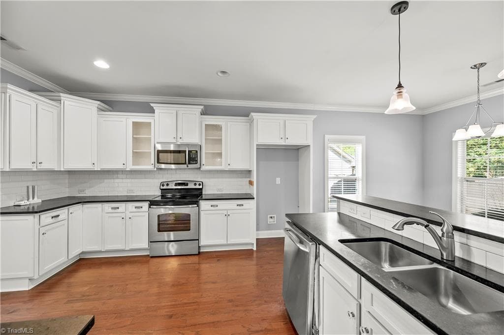 White kitchen, subway tile backsplash - 1249 Meadow Chase Drive, Lewisville NC 27023, Lewisville