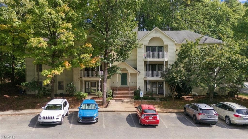Overhead view showing the parking lot at Quaker Commons Condominium. - 5928 W Friendly Avenue # M, Greensboro NC 27410, Greensboro