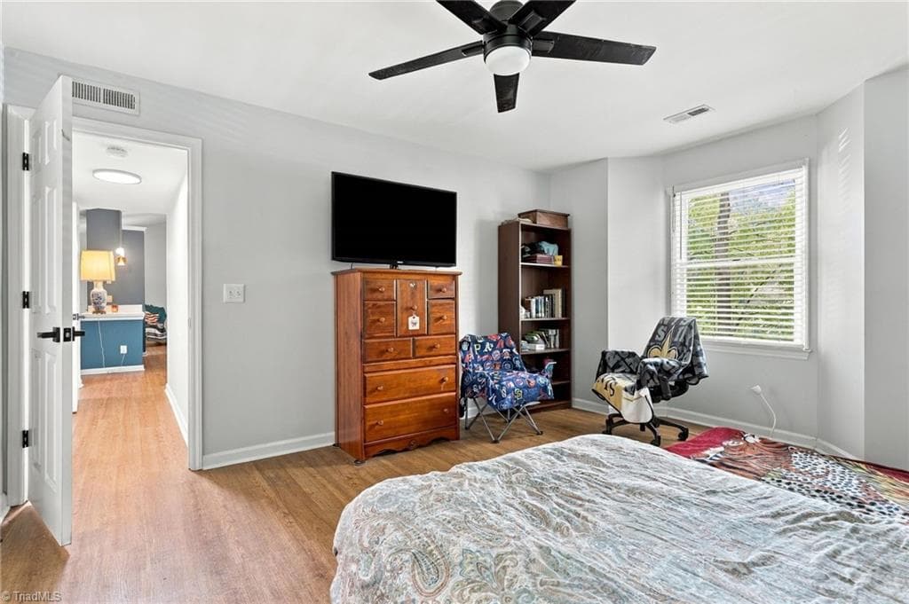 View of the hallway leading to the primary bedroom. - 5928 W Friendly Avenue # M, Greensboro NC 27410, Greensboro