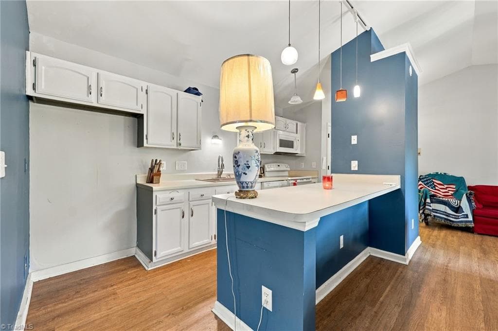 Kitchen with separate island and lots of counter spaces. - 5928 W Friendly Avenue # M, Greensboro NC 27410, Greensboro