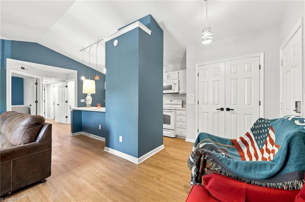 View of the kitchen from the living room. - 5928 W Friendly Avenue # M, Greensboro NC 27410, Greensboro