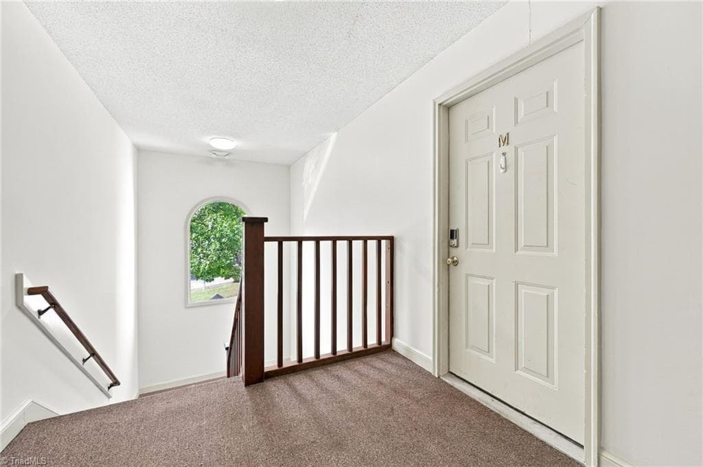 Staircase leading to Condo Upper Unit M at 5928 West Friendly Avenue. - 5928 W Friendly Avenue # M, Greensboro NC 27410, Greensboro
