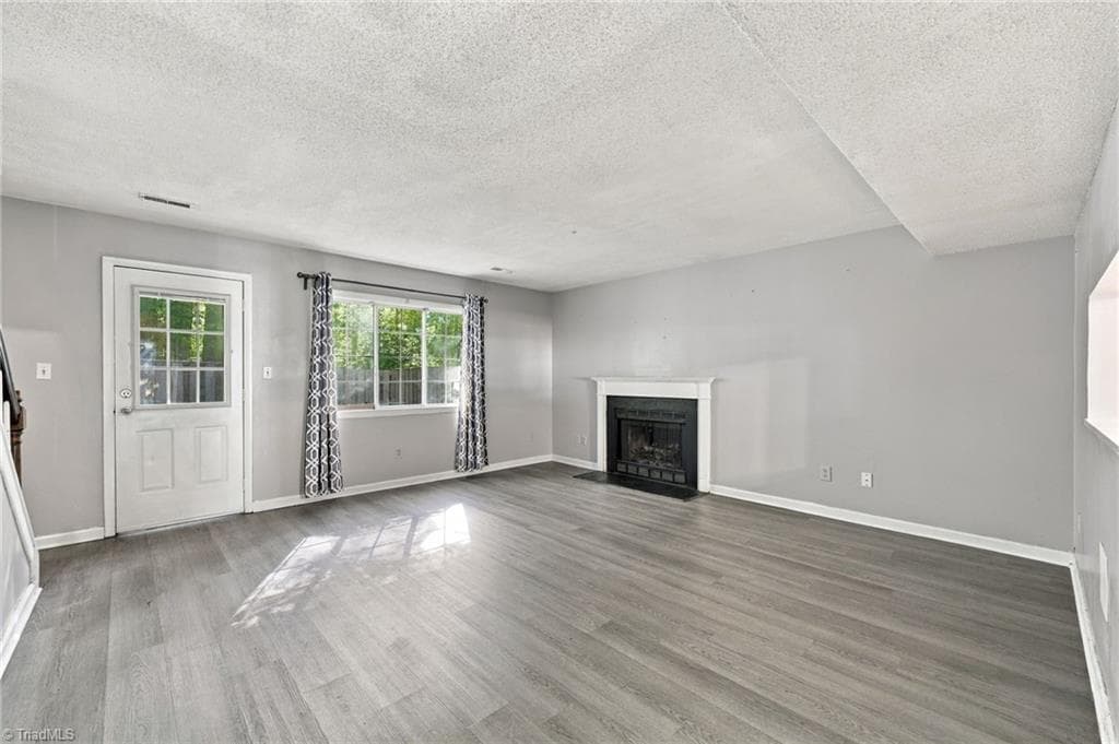 Living room on the main floor. - 5500 Richland Street # A, Greensboro NC 27409, Greensboro
