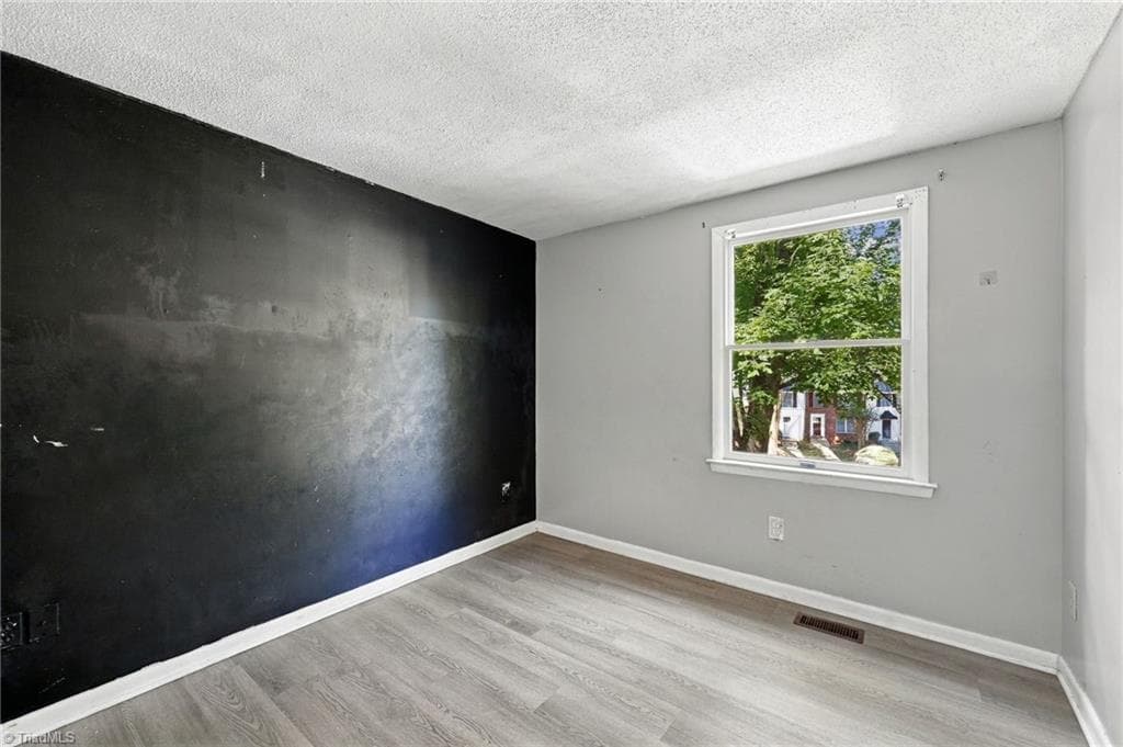 Third bedroom on the second floor area of the home. - 5500 Richland Street # A, Greensboro NC 27409, Greensboro