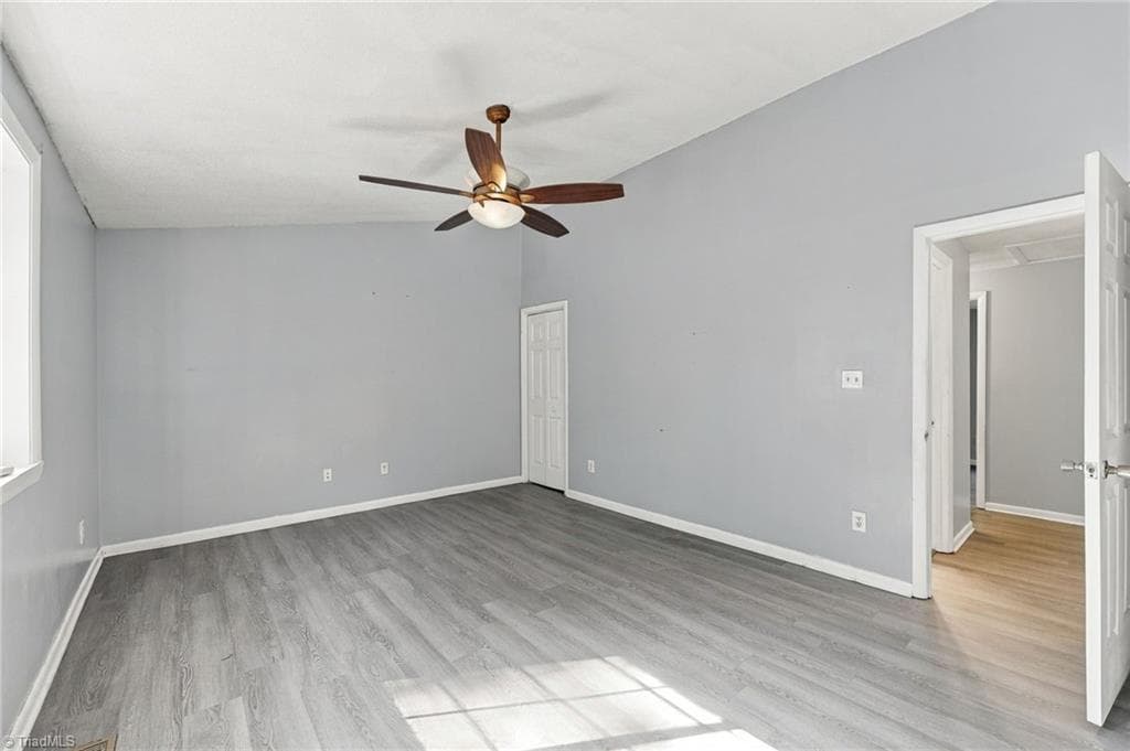Huge primary bedroom with walk in closet and ceiling fan. - 5500 Richland Street # A, Greensboro NC 27409, Greensboro