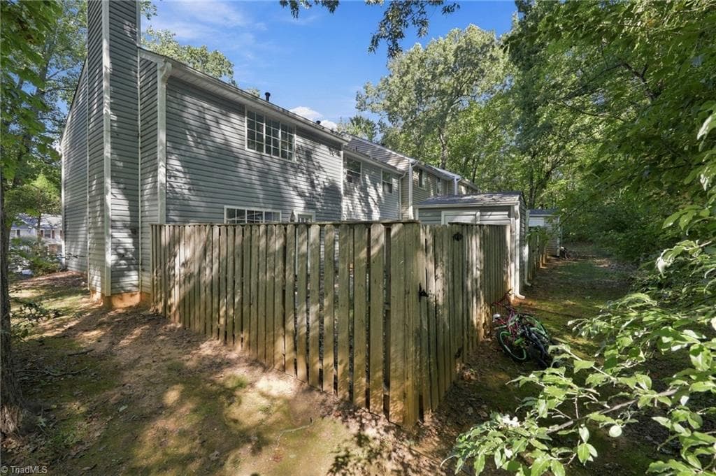 Another look at the fenced in backyard from outside. - 5500 Richland Street # A, Greensboro NC 27409, Greensboro
